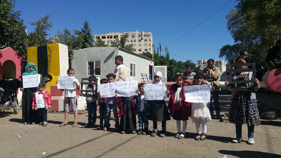 Children demand their parents release in a protest before OHCHR in Sana'a